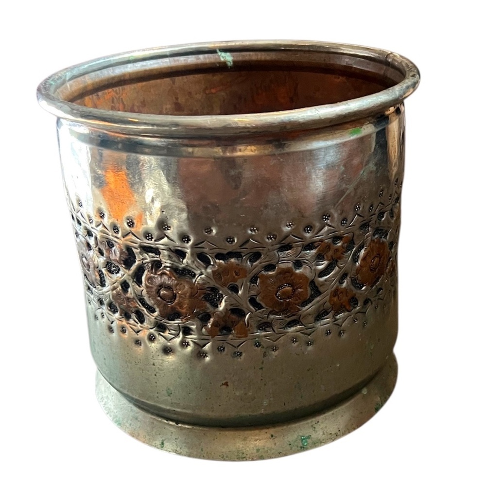 Hand-chiseled andโ embossed silver-plated copper vase holder